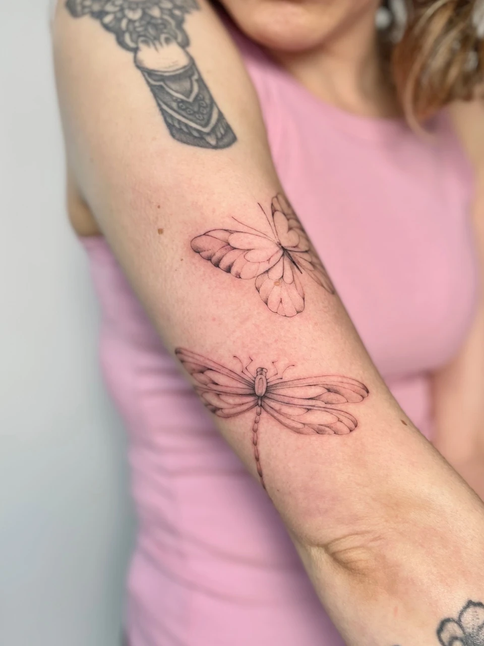 butterfly fine line tattoo on arm