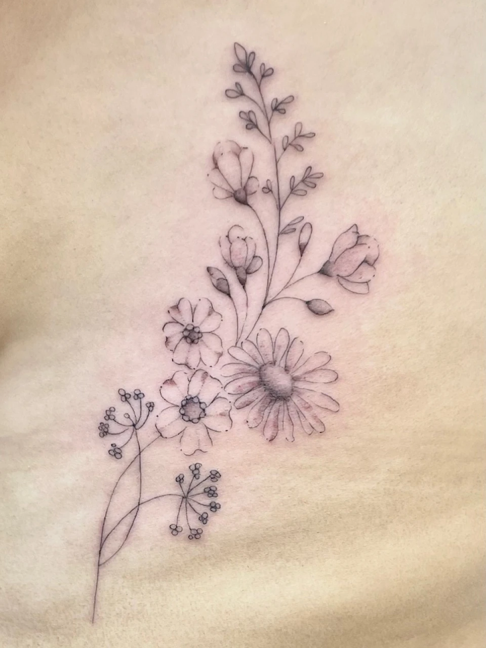 floral bouquet fine line tattoo